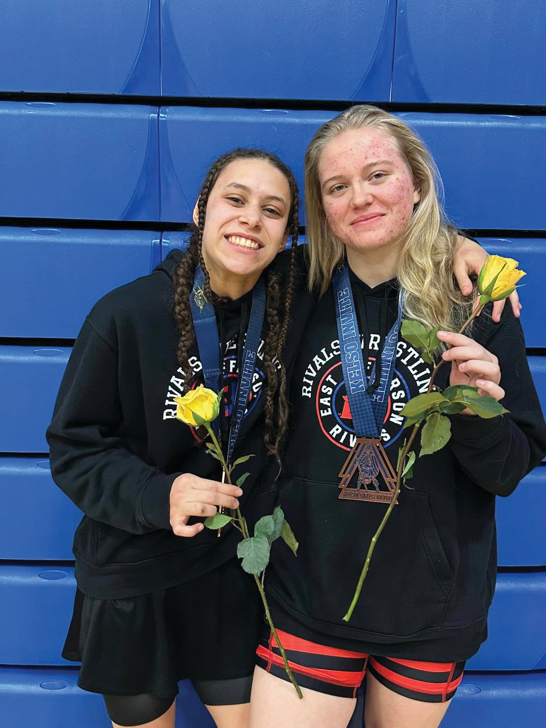 Mi Amada Lanphear Ramirez and Melody Douglas pose after wrestling in the WIAA Kelso Girls Invitational, the largest girls’ tournament in the nation.